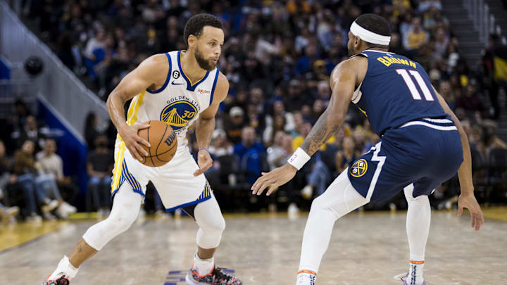 Oct 14, 2022; San Francisco, California, USA; Golden State Warriors guard Stephen Curry (30) dribbles as Denver Nuggets forward Bruce Brown (11) defends during the second half at Chase Center. Mandatory Credit: John Hefti-Imagn Images Oct 14, 2022; San Francisco, California, USA; Golden State Warriors guard Stephen Curry (30) dribbles as Denver Nuggets forward Bruce Brown (11) defends during the second half at Chase Center. Mandatory Credit: John Hefti-Imagn Images