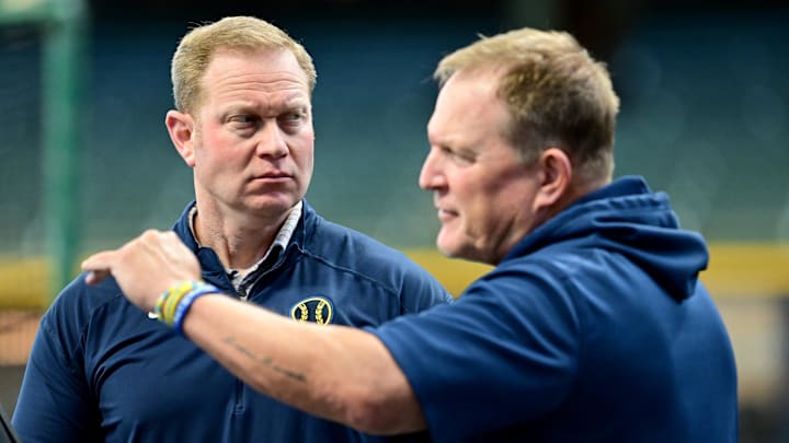 Oct 2, 2024; Milwaukee, Wisconsin, USA; Milwaukee Brewers general manager Matt Arnold talks to manager Matt Arnold before game two of the Wildcard round for the 2024 MLB Playoffs against the New York Mets at American Family Field. Mandatory Credit: Benny Sieu-Imagn Images