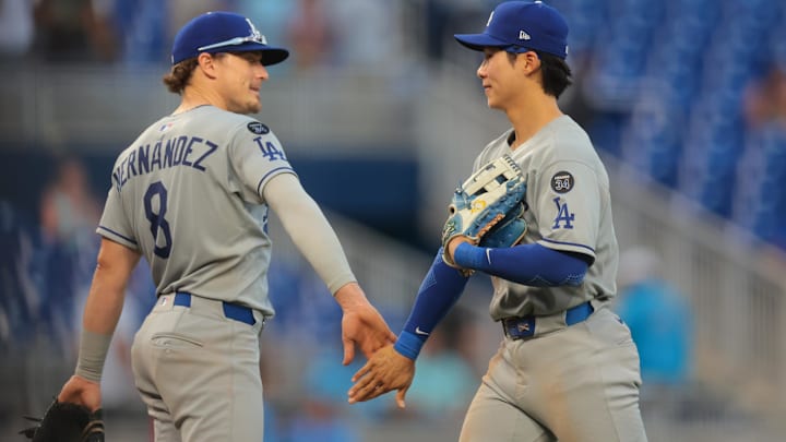 May 7, 2025; Miami, Florida, USA; Los Angeles Dodgers second baseman Hyeseong Kim (6) celebrates with second baseman Enrique Hernandez (8) after the game against the Miami Marlins at loanDepot Park. Mandatory Credit: Sam Navarro-Imagn Images