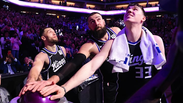 Feb 8, 2025; Sacramento, California, USA: Sacramento Kings guard Zach LaVine (8), center Jonas Valaciunas (17) and forward Jake LaRavia (33) look up after pushing the button to light the beam after a win against the New Orleans Pelicans at Golden 1 Center. Mandatory Credit: Kelley L Cox-Imagn Images