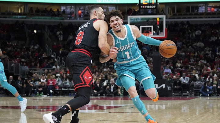 Jan 17, 2025; Chicago, Illinois, USA; Chicago Bulls guard Zach LaVine (8) defends Charlotte Hornets guard LaMelo Ball (1) during the second half at United Center. Mandatory Credit: David Banks-Imagn Images