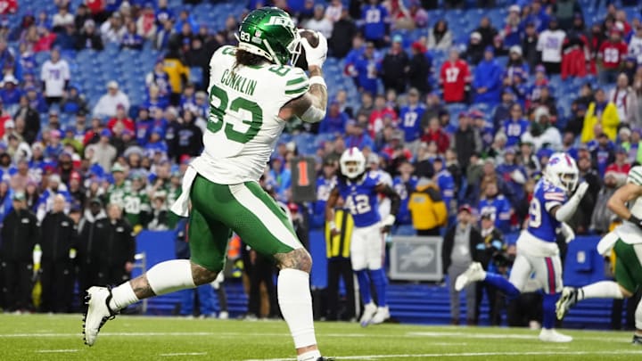Dec 29, 2024; Orchard Park, New York, USA; New York Jets tight end Tyler Conklin (83) makes a catch and scores a touchdown against the Buffalo Bills during the second half at Highmark Stadium.