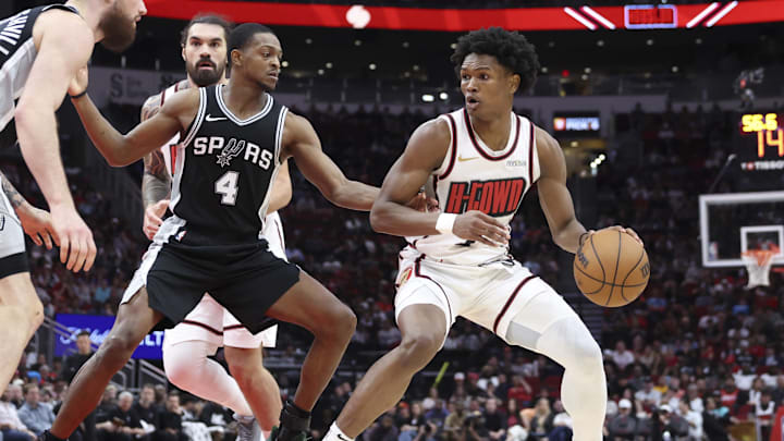 Feb 26, 2025; Houston, Texas, USA; Houston Rockets forward Amen Thompson (1) controls the ball as San Antonio Spurs guard De'Aaron Fox (4) defends during the third quarter at Toyota Center. Mandatory Credit: Troy Taormina-Imagn Images Feb 26, 2025; Houston, Texas, USA; Houston Rockets forward Amen Thompson (1) controls the ball as San Antonio Spurs guard De'Aaron Fox (4) defends during the third quarter at Toyota Center. Mandatory Credit: Troy Taormina-Imagn Images