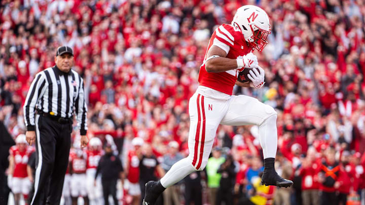 Nebraska Cornhuskers running back Dante Dowdell (23) scores a touchdown against the Wisconsin Badgers during the second quarter at Memorial Stadium.