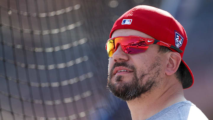 Feb 25, 2024; Clearwater, Florida, USA;  Philadelphia Phillies designated hitter Kyle Schwarber (12) takes batting practice before a game against the New York Yankees at BayCare Ballpark.