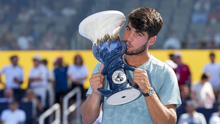 Aug 18, 2025; Carlos Alcaraz (ESP) poses for a photo with the Rookwood Cup after his match against Jannik Sinner (ITA) during the Cincinnati Open at the Lindner Family Tennis Center.