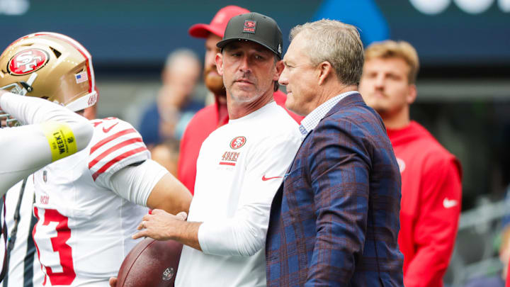 Sep 7, 2025; Seattle, Washington, USA; San Francisco 49ers general manager John Lynch, right, talks with head coach Kyle Shanahan during pregame warmups against the Seattle Seahawks at Lumen Field. Mandatory Credit: Joe Nicholson-Imagn Images