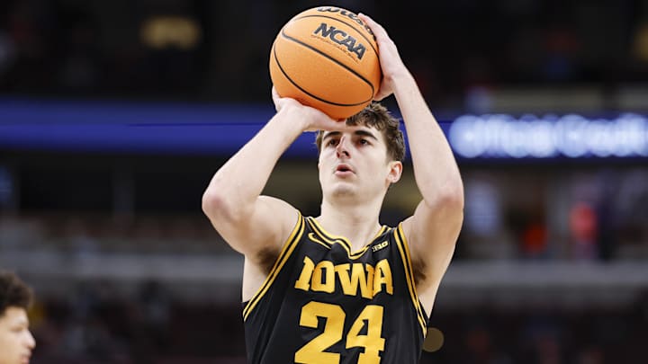 Mar 12, 2026; Chicago, IL, USA; Iowa Hawkeyes guard Tate Sage (24) shoots a free throw against the Ohio State Buckeyes during the first half at United Center. Mandatory Credit: Kamil Krzaczynski-Imagn Images