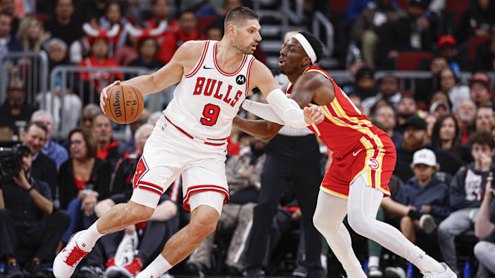 Oct 27, 2025; Chicago, Illinois, USA; Atlanta Hawks forward Onyeka Okongwu (17) defends against Chicago Bulls center Nikola Vucevic (9) during the second half at United Center. Mandatory Credit: Kamil Krzaczynski-Imagn Images