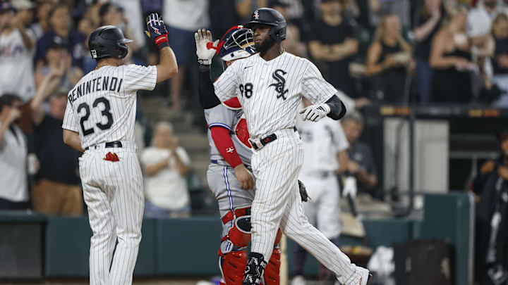 Jul 4, 2023; Chicago, Illinois, USA; Chicago White Sox center fielder Luis Robert Jr. (88) celebrates with left fielder Andrew Benintendi (23) after hitting a three-run home run against the Toronto Blue Jays during the sixth inning at Guaranteed Rate Field. Mandatory Credit: Kamil Krzaczynski-Imagn Images