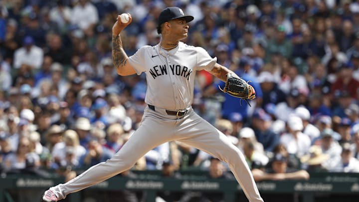 Sep 6, 2024; Chicago, Illinois, USA; New York Yankees starting pitcher Luis Gil (81) delivers a pitch against the Chicago Cubs during the first inning at Wrigley Field. Mandatory Credit: Kamil Krzaczynski-Imagn Images