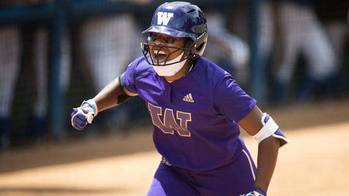 AUSL All-Star Cup pitcher and Team Kilfoyl member Sarah Willis  celebrates her solo homerun while playing for Washington during an NCAA D1 softball game against the UCLA Bruins at Easton Stadium on April 25, 2021 in Los Angeles.