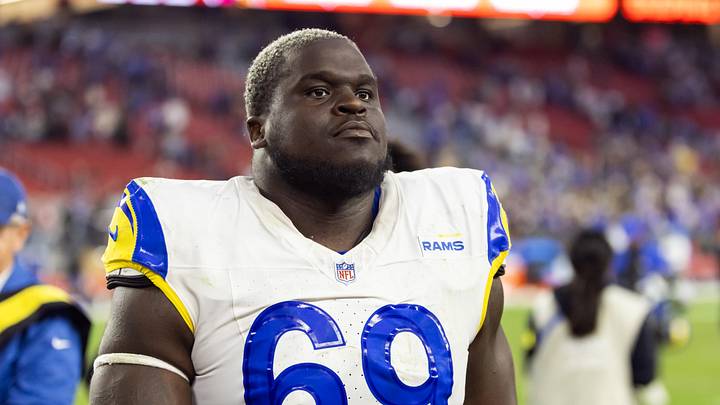 Dec 7, 2025; Glendale, Arizona, USA; Los Angeles Rams  offensive lineman Kevin Dotson (69) against the Arizona Cardinals at State Farm Stadium. Mandatory Credit: Mark J. Rebilas-Imagn Images