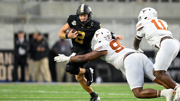 Oct 26, 2024; Nashville, Tennessee, USA; Texas Longhorns defensive lineman Alfred Collins (95) tackles Vanderbilt Commodores quarterback Diego Pavia (2) for a loss during the second half at FirstBank Stadium. Mandatory Credit: Steve Roberts-Imagn Images Oct 26, 2024; Nashville, Tennessee, USA; Texas Longhorns defensive lineman Alfred Collins (95) tackles Vanderbilt Commodores quarterback Diego Pavia (2) for a loss during the second half at FirstBank Stadium. Mandatory Credit: Steve Roberts-Imagn Images