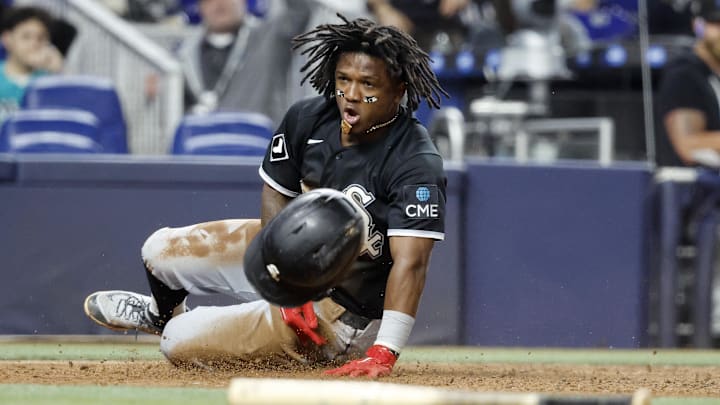 Mar 30, 2026; Miami, Florida, USA;  Chicago White Sox second baseman Luisangel Acuna (0) reacts after scoring under the tag of Miami Marlins catcher Liam Hicks (not pictured) during the sixth inning at loanDepot Park. Mandatory Credit: Rhona Wise-Imagn Images