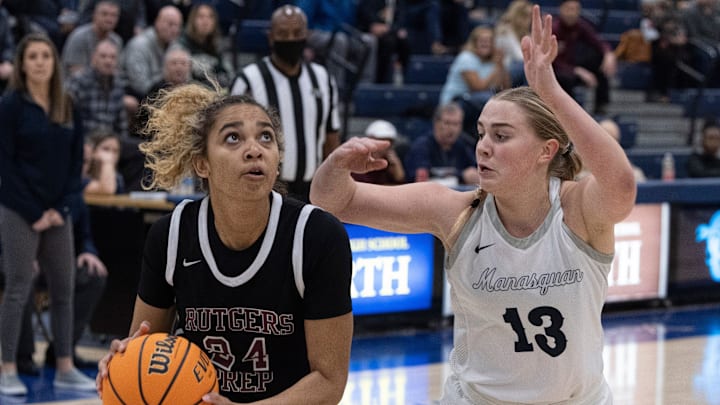 Rutgers Antonia Bates lines up her shot as Manasquan Hope Masonius moves in to block. Manasquan Girls Basketball vs Rutgers Prep in NJSIAA Tournament of Champions Semifinals on March 18, 2022 in Toms River, NJ.Gbbsqrp220318bs