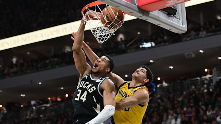 Apr 27, 2025; Milwaukee, Wisconsin, USA: Milwaukee Bucks forward Giannis Antetokounmpo (34) dunks the ball against Indiana Pacers guard Ben Sheppard (26) in the third quarter during game four of first round for the 2024 NBA Playoffs at Fiserv Forum. Mandatory Credit: Benny Sieu-Imagn Images