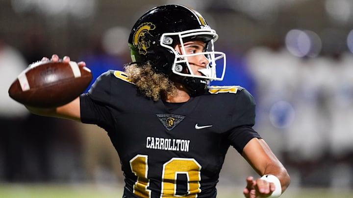 Oct 20, 2023; Carrollton, GA, USA; Carrollton Trojans quarterback Julian Lewis (10) drops back to pass against the Westlake Lions during the first half at Grisham Stadium. The 15-year-old Carrollton High student has already committed to playing for the University of Southern California Trojans and has been considered one of the top high school quarterback prospects. Mandatory Credit: John David Mercer-Imagn Images Oct 20, 2023; Carrollton, GA, USA; Carrollton Trojans quarterback Julian Lewis (10) drops back to pass against the Westlake Lions during the first half at Grisham Stadium. The 15-year-old Carrollton High student has already committed to playing for the University of Southern California Trojans and has been considered one of the top high school quarterback prospects. Mandatory Credit: John David Mercer-Imagn Images