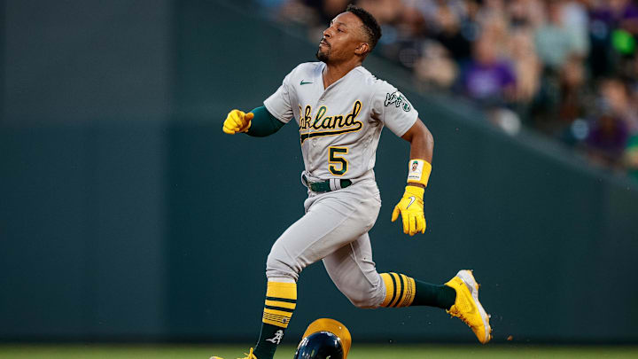 Jul 28, 2023; Denver, Colorado, USA; Oakland Athletics left fielder Tony Kemp (5) loses his helmet as he runs to second on a double in the fifth inning against the Colorado Rockies at Coors Field. Mandatory Credit: Isaiah J. Downing-Imagn Images Jul 28, 2023; Denver, Colorado, USA; Oakland Athletics left fielder Tony Kemp (5) loses his helmet as he runs to second on a double in the fifth inning against the Colorado Rockies at Coors Field. Mandatory Credit: Isaiah J. Downing-Imagn Images