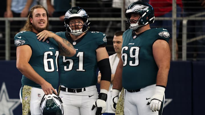  Philadelphia Eagles center Nick Gates (61) and center Cam Jurgens (51) and guard Landon Dickerson (69) stand on the field before the game against the Dallas Cowboys at AT&T Stadium.