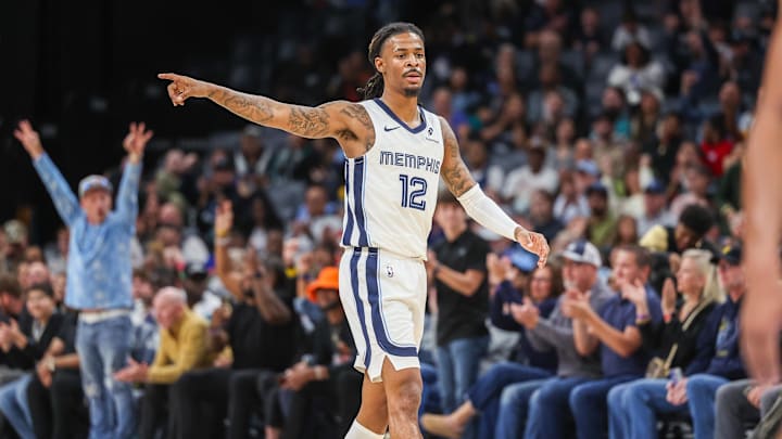 Oct 25, 2025; Memphis, Tennessee, USA; Memphis Grizzlies guard Ja Morant (12) reacts after a made basket against the Indiana Pacers during the first half at FedExForum. Mandatory Credit: Wesley Hale-Imagn Images