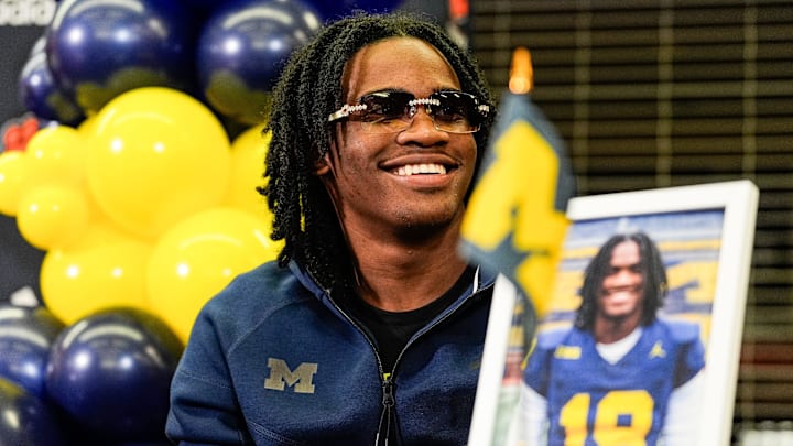 Michigan signee Bryce Underwood smiles during national signing day at Belleville High School in Belleville on Wednesday, Dec. 4, 2024. Michigan signee Bryce Underwood smiles during national signing day at Belleville High School in Belleville on Wednesday, Dec. 4, 2024.