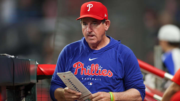 Aug 21, 2024; Atlanta, Georgia, USA; Philadelphia Phillies manager Rob Thomson (59) in the dugout against the Atlanta Braves in the sixth inning at Truist Park