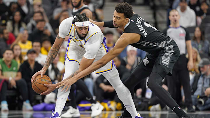Los Angeles Lakers forward Anthony Davis (3) looks to pass the ball while defended by San Antonio Spurs center Victor Wembanyama (1) during the first half during the first half at Frost Bank Center. Mandatory Credit: Scott Wachter-Imagn Images Los Angeles Lakers forward Anthony Davis (3) looks to pass the ball while defended by San Antonio Spurs center Victor Wembanyama (1) during the first half during the first half at Frost Bank Center. Mandatory Credit: Scott Wachter-Imagn Images