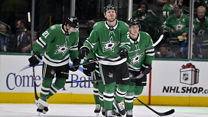 Dec 20, 2024; Dallas, Texas, USA; Dallas Stars center Roope Hintz (24) and left wing Jason Robertson (21) and defenseman Nils Lundkvist (5) skate off the ice after Hintz scores a goal against the New York Rangers during the first period at the American Airlines Center. Mandatory Credit: Jerome Miron-Imagn Images
