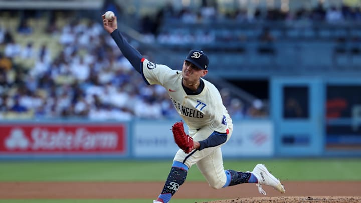 Aug 10, 2024; Los Angeles, California, USA;  Los Angeles Dodgers starting pitcher River Ryan (77) pitches during the third inning against the Pittsburgh Pirates at Dodger Stadium. Mandatory Credit: Kiyoshi Mio-Imagn Images