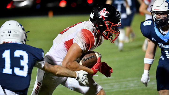 Jupiter Christian wide receiver Cayden Alula (#13) looks to slip between ODA defenders. The Out of Door Academy Thunder hosted the Jupiter Christian Eagles in the SSAA Class 5A semifinal game Friday night, Nov. 8, 2024. The Eagles defeated the Thunder 29-26.
