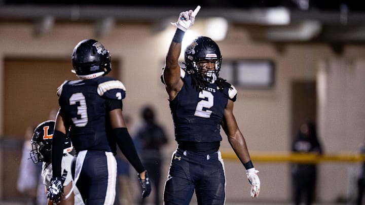 Buchholz Bobcats middle linebacker Myles Graham (2) gestures after a defensive stop during the first