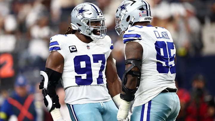Dallas Cowboys defensive tackles Osa Odighizuwa and Kenny Clark after a play against the New York Giants.