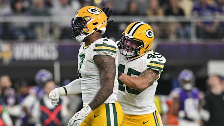 Dec 31, 2023; Minneapolis, Minnesota, USA; Green Bay Packers linebacker Quay Walker (7) and linebacker Eric Wilson (45) react after a sack by Walker against the Minnesota Vikings during the second quarter at U.S. Bank Stadium.