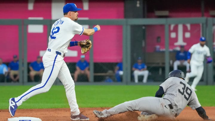 Jun 12, 2024; Kansas City, Missouri, USA; Kansas City Royals second baseman Nick Loftin (12) gets the force out at second base on New York Yankees catcher Jose Trevino (39) and throws to first for a double play in the sixth inning at Kauffman Stadium.