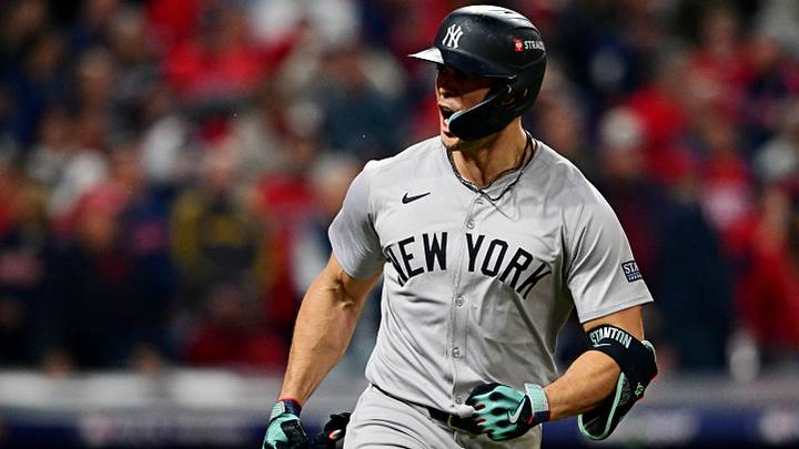 Oct 19, 2024: New York Yankees designated hitter Giancarlo Stanton (27) celebrates after hitting a two run home run during the sixth inning against the Cleveland Guardians during game five of the ALCS for the 2024 MLB playoffs at Progressive Field. Credit: David Dermer-Imagn Images
