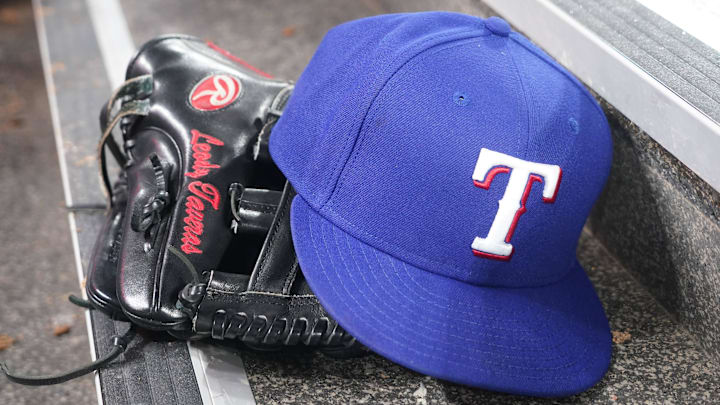 Jul 26, 2024; Toronto, Ontario, CAN; The hat and glove of Texas Rangers fielder Leody Taveras (3) during a game against the Toronto Blue Jays at Rogers Centre. Mandatory Credit: John E. Sokolowski-Imagn Images