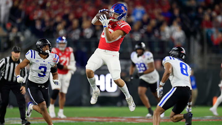 Mississippi Rebels tight end Caden Prieskorn (86) hauls in a reception between Duke Blue Devils linebacker Alex Howard (3) and safety DaShawn Stone (8) during the first quarter of the TaxSlayer Gator Bowl Thursday, Jan. 2, 2025 at EverBank Stadium in Jacksonville, Fla. [Corey Perrine/Florida Times-Union]