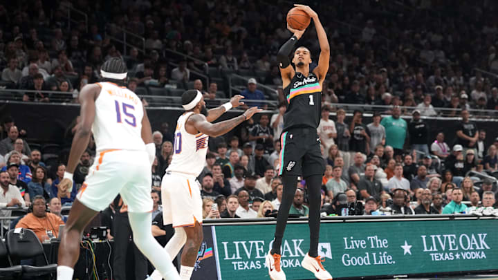 Feb 19, 2026; Austin, Texas, USA; San Antonio Spurs forward Victor Wembanyama (1) shoots over Phoenix Suns forward Royce O’Neale (00) during the first half at Moody Center. Mandatory Credit: Scott Wachter-Imagn Images