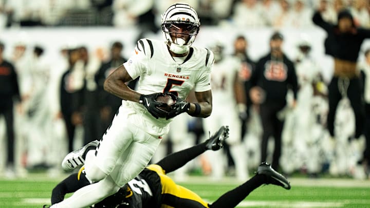Cincinnati Bengals wide receiver Tee Higgins (5) catches a pass and runs for a touchdown in the second quarter of the NFL game between the Cincinnati Bengals and Pittsburgh Steelers at Paycor Stadium in Cincinnati on Oct. 16, 2025. Cincinnati Bengals wide receiver Tee Higgins (5) catches a pass and runs for a touchdown in the second quarter of the NFL game between the Cincinnati Bengals and Pittsburgh Steelers at Paycor Stadium in Cincinnati on Oct. 16, 2025.