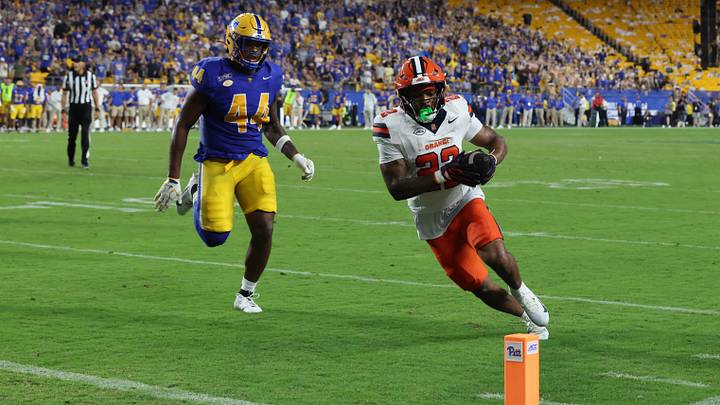 Sep 17, 2026; Pittsburgh, Pennsylvania, USA; Syracuse Orange running back Ahmad Miller (22) scores a touchdown during the second quarter against the Pittsburgh Panthers at Acrisure Stadium. Mandatory Credit: Charles LeClaire-Imagn Images Sep 17, 2026; Pittsburgh, Pennsylvania, USA; Syracuse Orange running back Ahmad Miller (22) scores a touchdown during the second quarter against the Pittsburgh Panthers at Acrisure Stadium. Mandatory Credit: Charles LeClaire-Imagn Images
