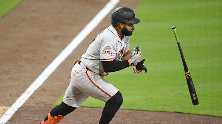Mar 31, 2026; San Diego, California, USA; San Francisco Giants left fielder Heliot Ramos (17) hits an RBI single during the sixth inning against the San Diego Padres at Petco Park. Mandatory Credit: Denis Poroy-Imagn Images