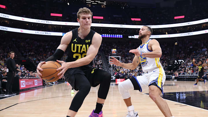 Oct 25, 2024; Salt Lake City, Utah, USA; Utah Jazz forward Lauri Markkanen (23) and Golden State Warriors guard Stephen Curry (30) go for a loose ball during the third quarter at Delta Center. Mandatory Credit: Rob Gray-Imagn Images
