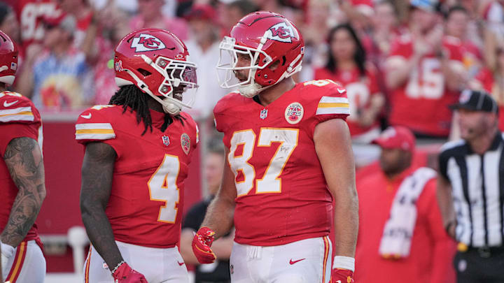Sep 15, 2024; Kansas City, Missouri, USA; Kansas City Chiefs tight end Travis Kelce (87) celebrates with wide receiver Rashee Rice (4) after a play against the Cincinnati Bengals during the game at GEHA Field at Arrowhead Stadium. Mandatory Credit: Denny Medley-Imagn Images