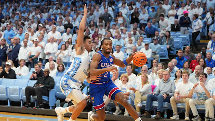 Nov 7, 2025; Chapel Hill, North Carolina, USA; Kansas Jayhawks guard Darryn Peterson (22) with the ball as North Carolina Tar Heels guard Seth Trimble (7) defends in the first half at Dean E. Smith Center. Mandatory Credit: Bob Donnan-Imagn Images Nov 7, 2025; Chapel Hill, North Carolina, USA; Kansas Jayhawks guard Darryn Peterson (22) with the ball as North Carolina Tar Heels guard Seth Trimble (7) defends in the first half at Dean E. Smith Center. Mandatory Credit: Bob Donnan-Imagn Images