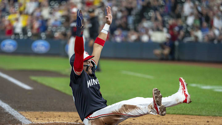 Sep 25, 2024; Minneapolis, Minnesota, USA; Minnesota Twins third baseman Royce Lewis (23) celebrates scoring a run against the Miami Marlins in the seventh inning at Target Field. Mandatory Credit: Jesse Johnson-Imagn Images