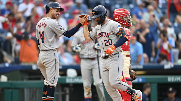 Aug 28, 2024; Philadelphia, Pennsylvania, USA; Houston Astros outfielder Chas McCormick (20) celebrates with outfielder Mauricio Dubon (14) after hitting a two-run home run against the Philadelphia Phillies in the eighth inning at Citizens Bank Park.
