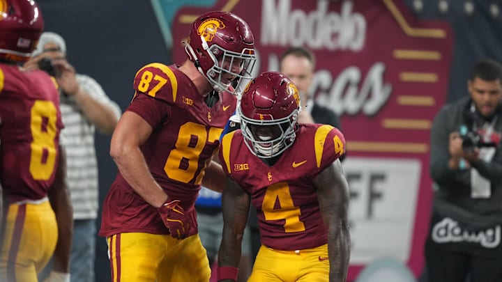 Sep 1, 2024; Paradise, Nevada, USA; Southern California Trojans running back Woody Marks (4) celebrates with tight end Lake McRee (87) after scoring on a 13-yard touchdown run with eight seconds left against the LSU Tigers at Allegiant Stadium. Mandatory Credit: Kirby Lee-Imagn Images Sep 1, 2024; Paradise, Nevada, USA; Southern California Trojans running back Woody Marks (4) celebrates with tight end Lake McRee (87) after scoring on a 13-yard touchdown run with eight seconds left against the LSU Tigers at Allegiant Stadium. Mandatory Credit: Kirby Lee-Imagn Images