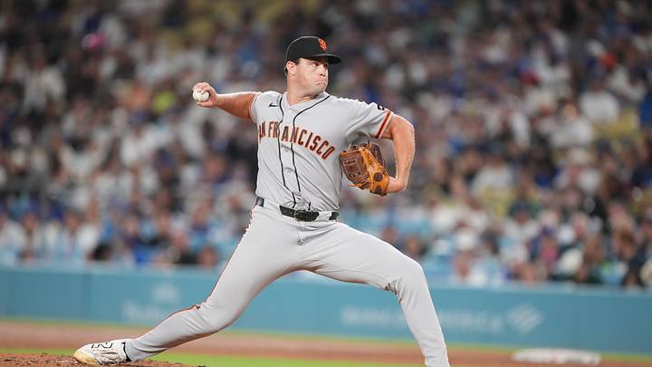 Sep 18, 2026; Los Angeles, California, USA;  San Francisco Giants pitcher Carson Seymour (77) pitches during the seventh inning against the Los Angeles Dodgers at Dodger Stadium.  Mandatory Credit: Kirby Lee-Imagn Images