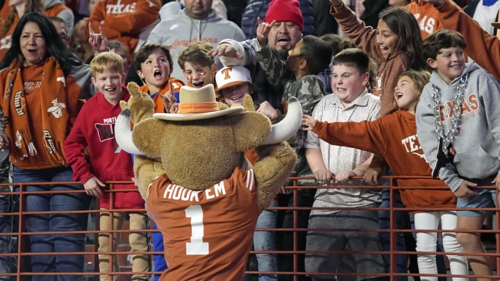 Texas Longhorns mascot Hook Em visits with fans during the second half of the game against the Texas Tech Red Raiders at Darrell K Royal-Texas Memorial Stadium. 